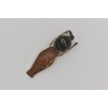 A WWI FUMSUP CHARM, wooden head and metal body with moveable arms, approximate length 31mm, (