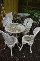 A WHITE PAINTED ALUMINIUM CURCULAR GARDEN TABLE, diameter 69cm x height 64cm, and four chairs (