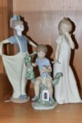 A GROUP OF THREE NAO FIGURES, comprising 'My Feathered Friend' model no 1353, 'Girl Yawning', height