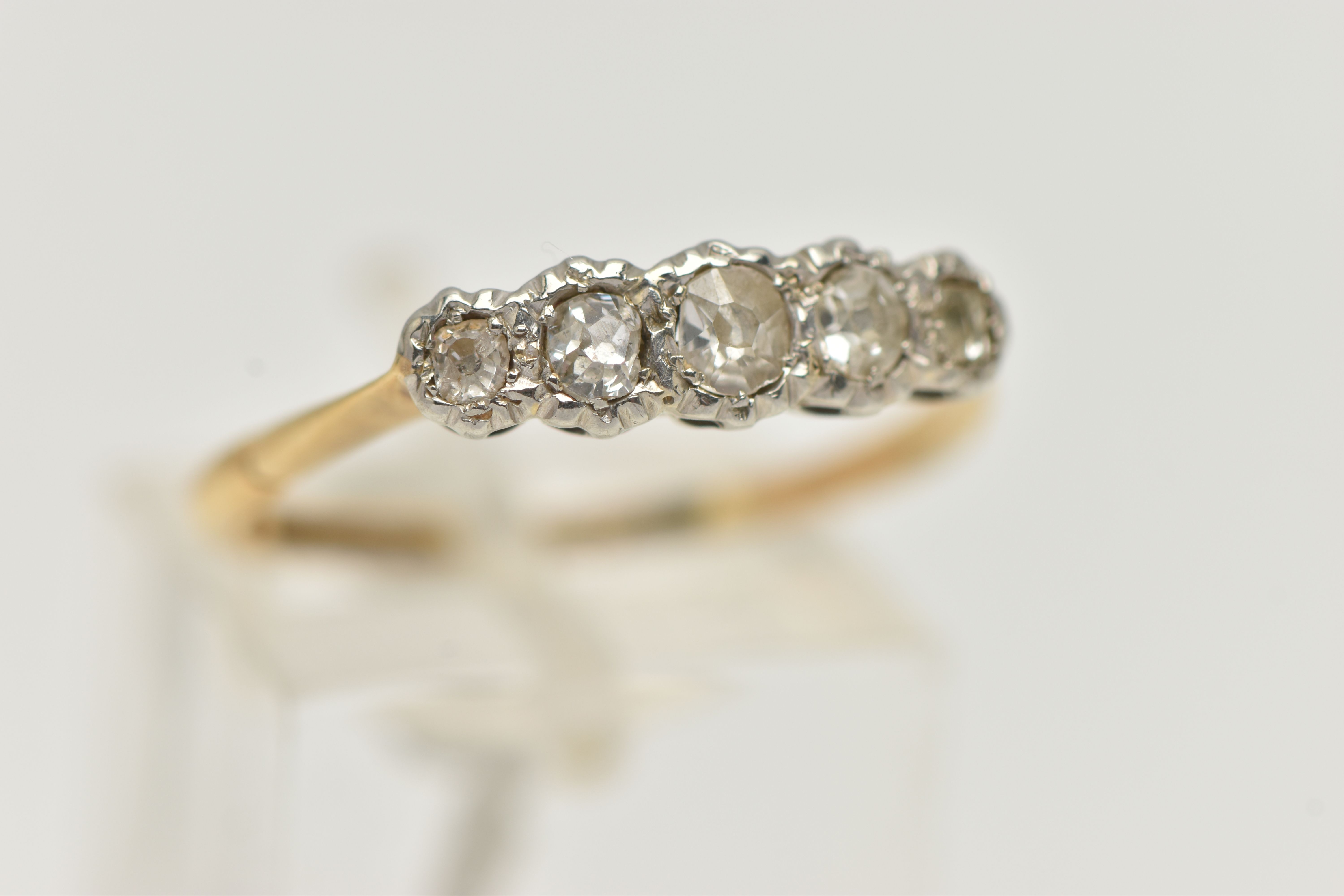 A YELLOW AND WHITE METAL DIAMOND FIVE STONE RING, set with five graduated old cut diamonds, - Image 4 of 4