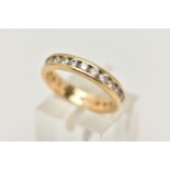 AN 18CT GOLD DIAMOND FULL ETERNITY BAND RING, channel set with twenty four round brilliant cut