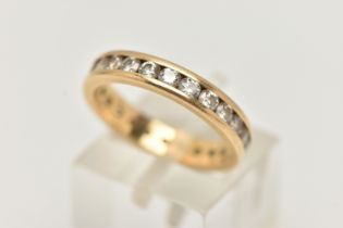 AN 18CT GOLD DIAMOND FULL ETERNITY BAND RING, channel set with twenty four round brilliant cut