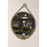 A BARBOLA MIRROR, the circular mirror in a teardrop shaped frame, decorated with flowers and