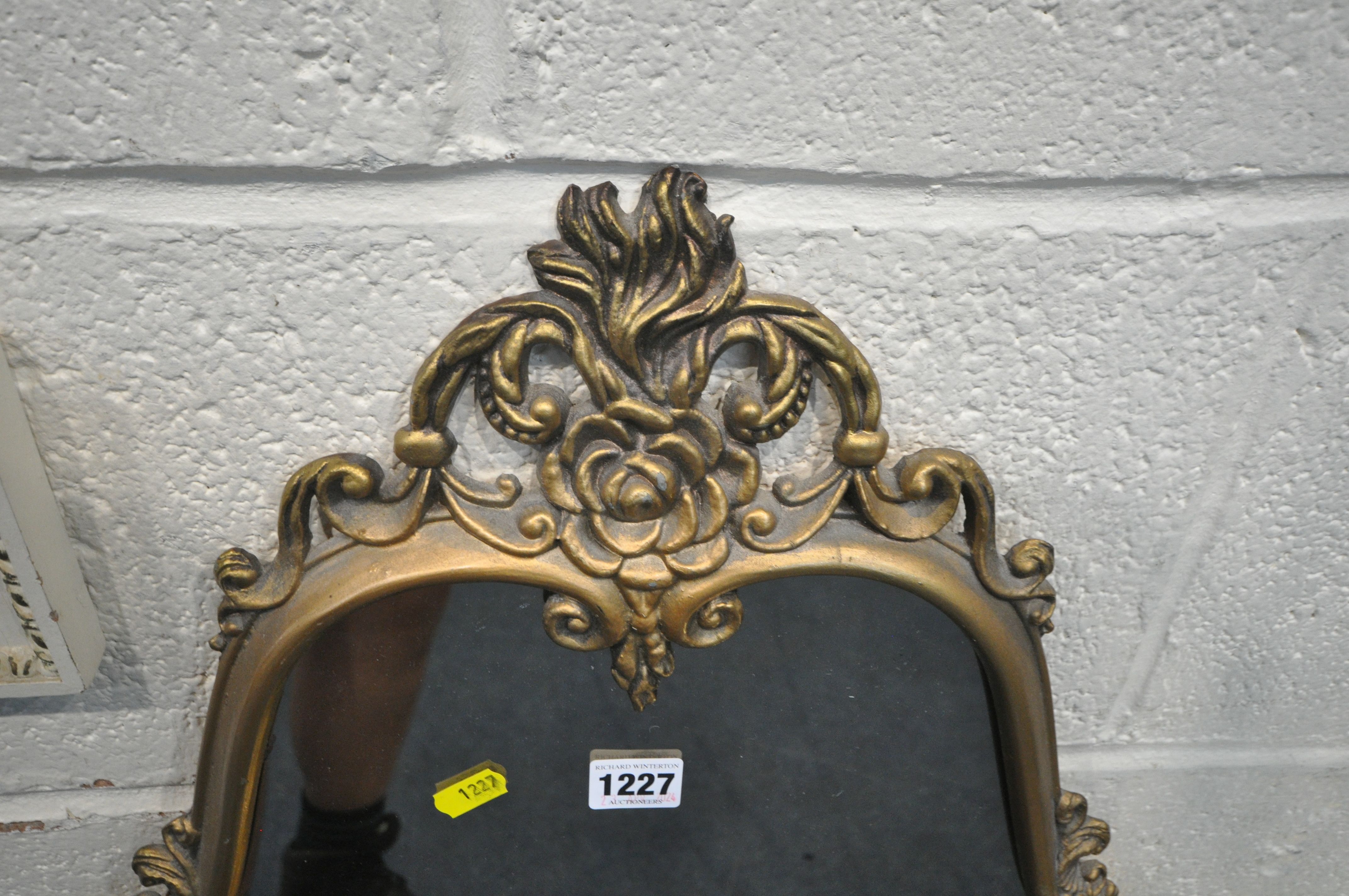 A GILT METAL FRAMED WALL MIRROR, with scrolled and foliate details, 50cm x 110cm, a French wall - Image 3 of 5