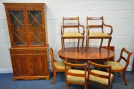 A LATE 20TH CENTURY YEW WOOD EIGHT PIECE SUITE, comprising an oval dining table, with an