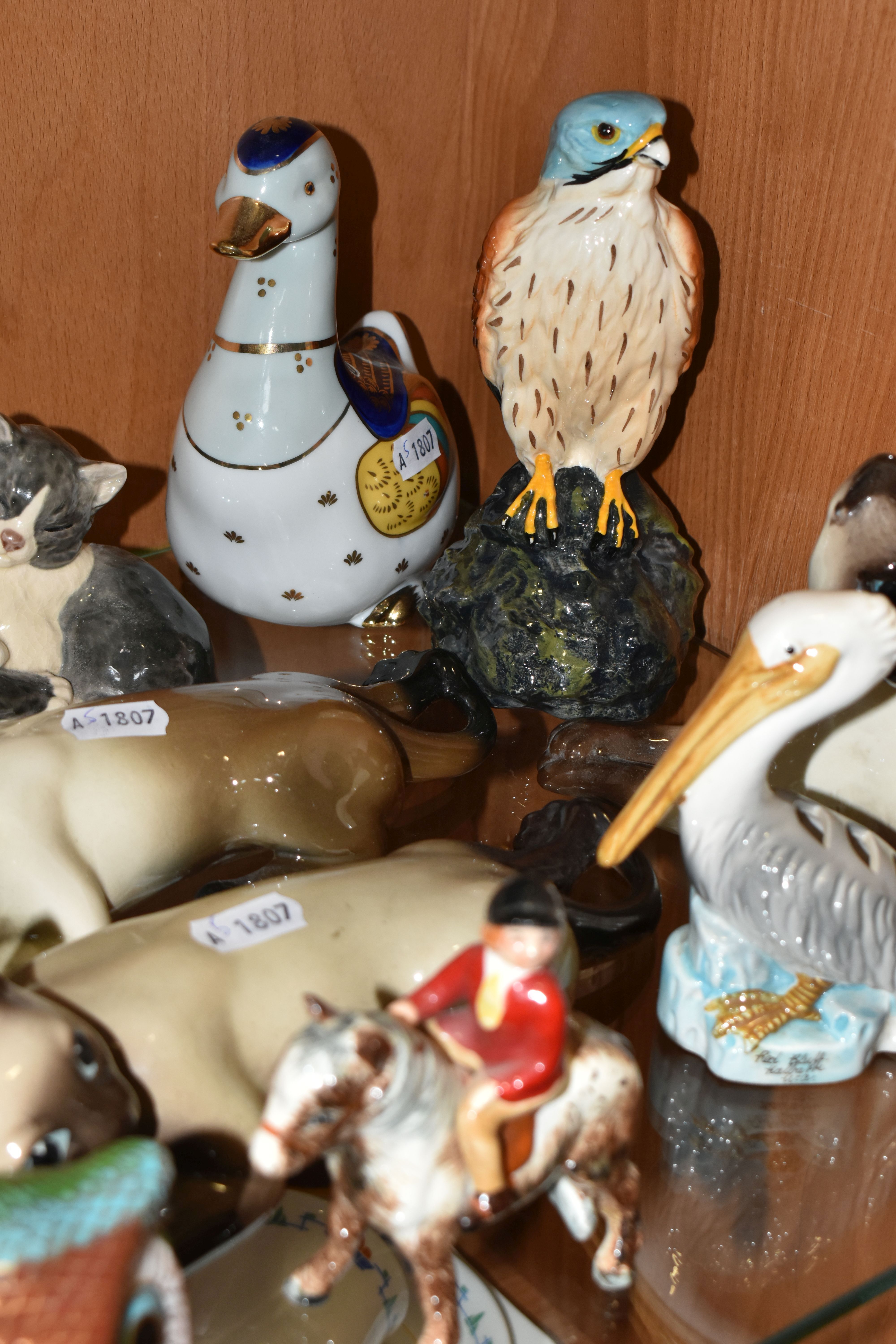 A COLLECTION OF ANIMAL AND BIRD FIGURES, over twenty pieces, to include a Beswick lying down Siamese - Image 4 of 11