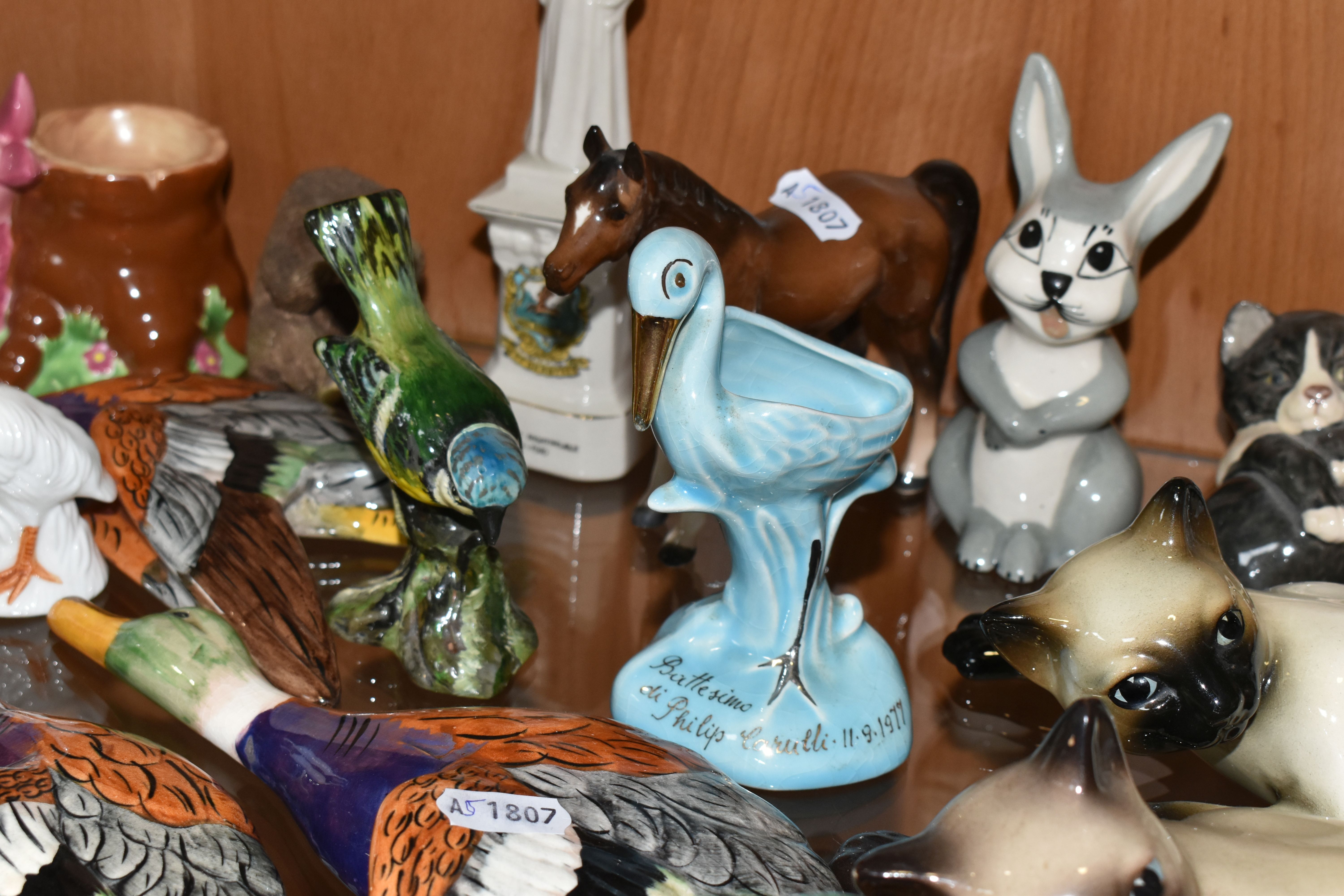 A COLLECTION OF ANIMAL AND BIRD FIGURES, over twenty pieces, to include a Beswick lying down Siamese - Image 6 of 11