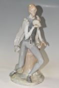 A LLADRO SCULPTURE OF HAMLET WITH A SKULL, model number 4729 designed by Alfredo Ruiz, issued 1970
