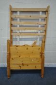 A MODERN PINE SINGLE BEDSTEAD, with siderails, slats and bolts (condition report: couple of slats