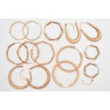 A BAG OF YELLOW METAL HOOP EARRINGS, to include five pairs of round hollow hoops, two pairs