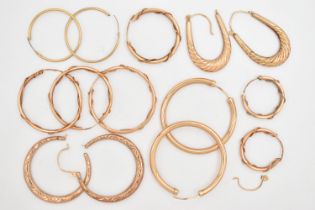 A BAG OF YELLOW METAL HOOP EARRINGS, to include five pairs of round hollow hoops, two pairs