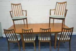 MCINTOSH OF KIRKCALDY, A MID CENTURY TEAK EXTENDING DINING TABLE, with two fold out leaves, raised