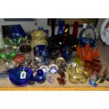 A GROUP OF COLOURED GLASSWARE, including assorted modern paperweights, a handkerchief vase, ashtrays