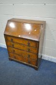 A 20TH CENTURY BURR WALNUT BUREAU, the fall front door enclosing a fitted interior, above four