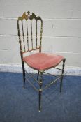 AN ITALIAN MID CENTURY BRASS CHIAVARI CHAIR, with shaped crest, spindle style back rest, a pink