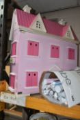A MODERN WOODEN DOLLS HOUSE, pink with white trim, front opening to reveal two rooms over two