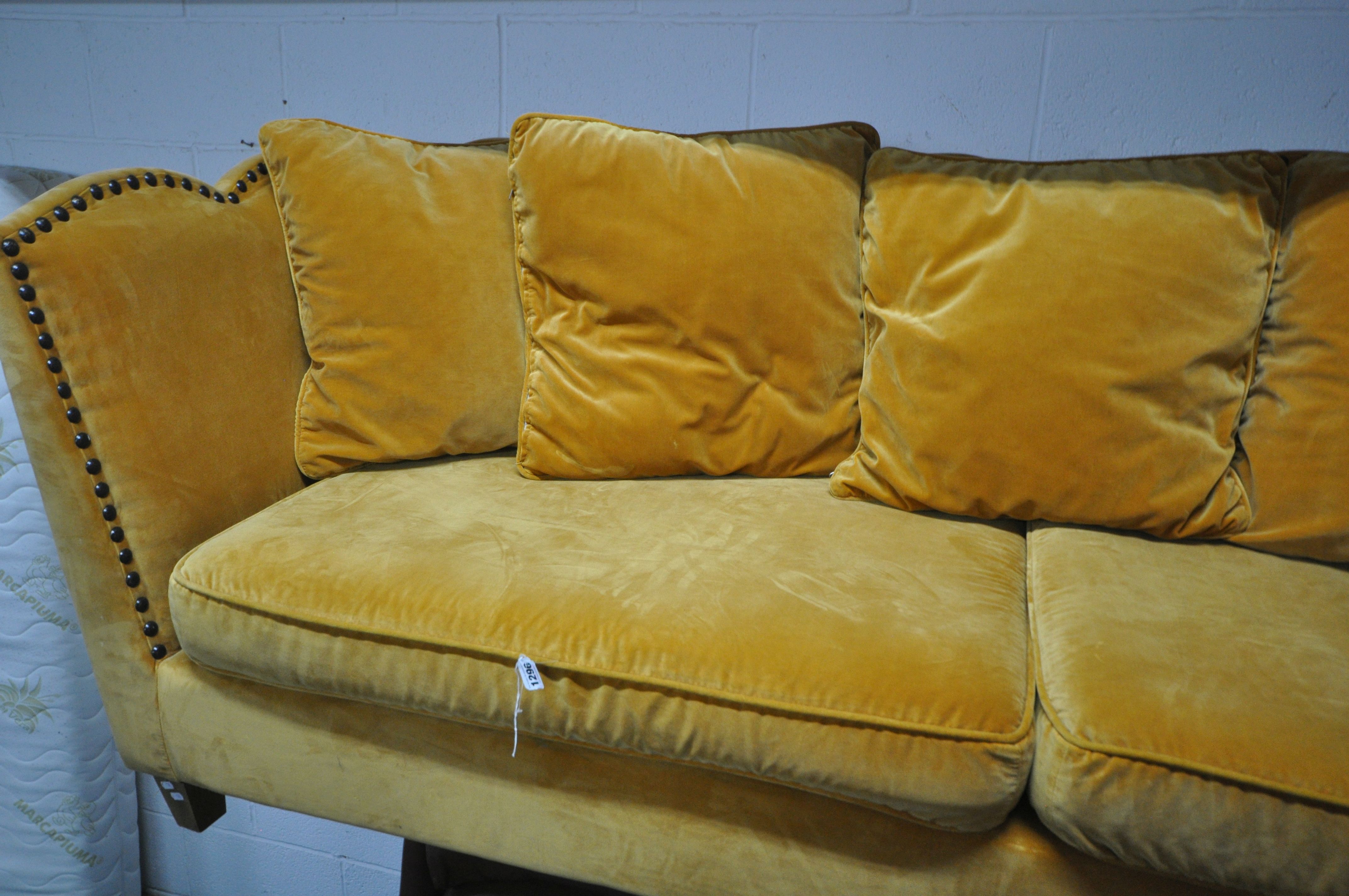 A GOLD VELOUR UPHOLSTERED SOFA, with a studded back, sides, and a shaped top, on square light oak - Image 3 of 8