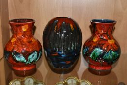 THREE ANITA HARRIS ART POTTERY VASES, two florally decorated baluster vases, with printed