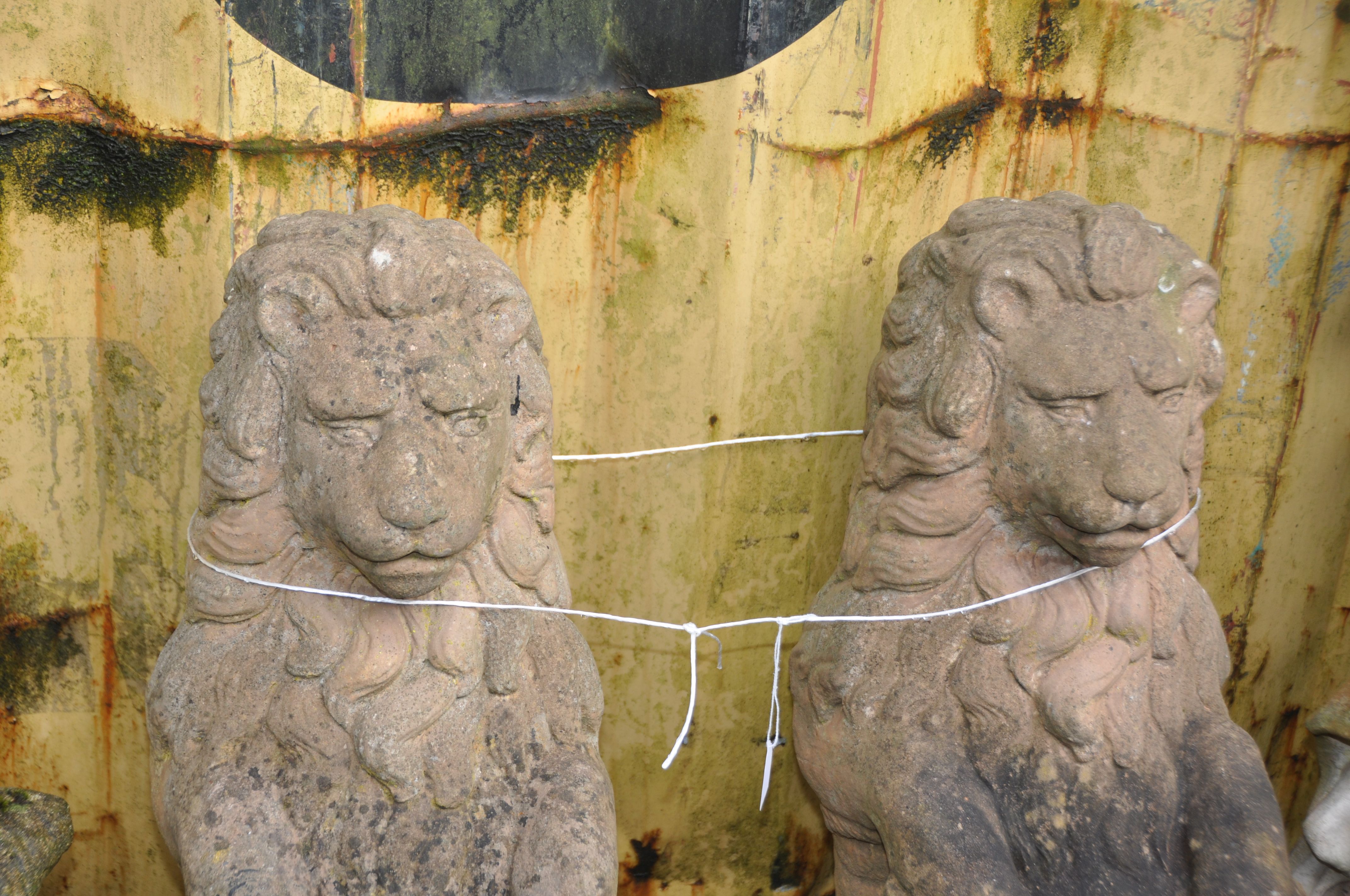 A PAIR OF WEATHERED COMPOSITE GARDEN FIGURES in the form of lion standing on their back legs holding - Image 3 of 3