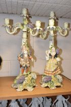 A PAIR OF PLAUE FIGURAL CANDELABRA, the four sconce candelabra decorated with detailed modelled