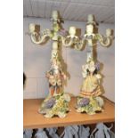 A PAIR OF PLAUE FIGURAL CANDELABRA, the four sconce candelabra decorated with detailed modelled