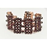 A LATE 19TH CENTURY BOHEMIAN GARNET BRACELET, designed as rectangular faceted garnet set panels,