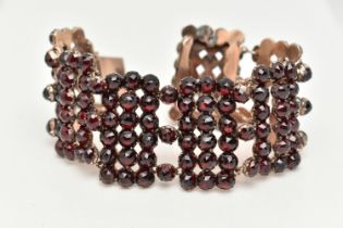 A LATE 19TH CENTURY BOHEMIAN GARNET BRACELET, designed as rectangular faceted garnet set panels,