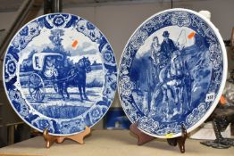 TWO DELFT CHARGERS, blue and white with blue printed Delft mark to the base, depicting a carriage