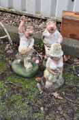 THREE WESTHERED COMPOSITE NOVELTY GARDEN FIGURES including a cricketer, a rugby player and a crown