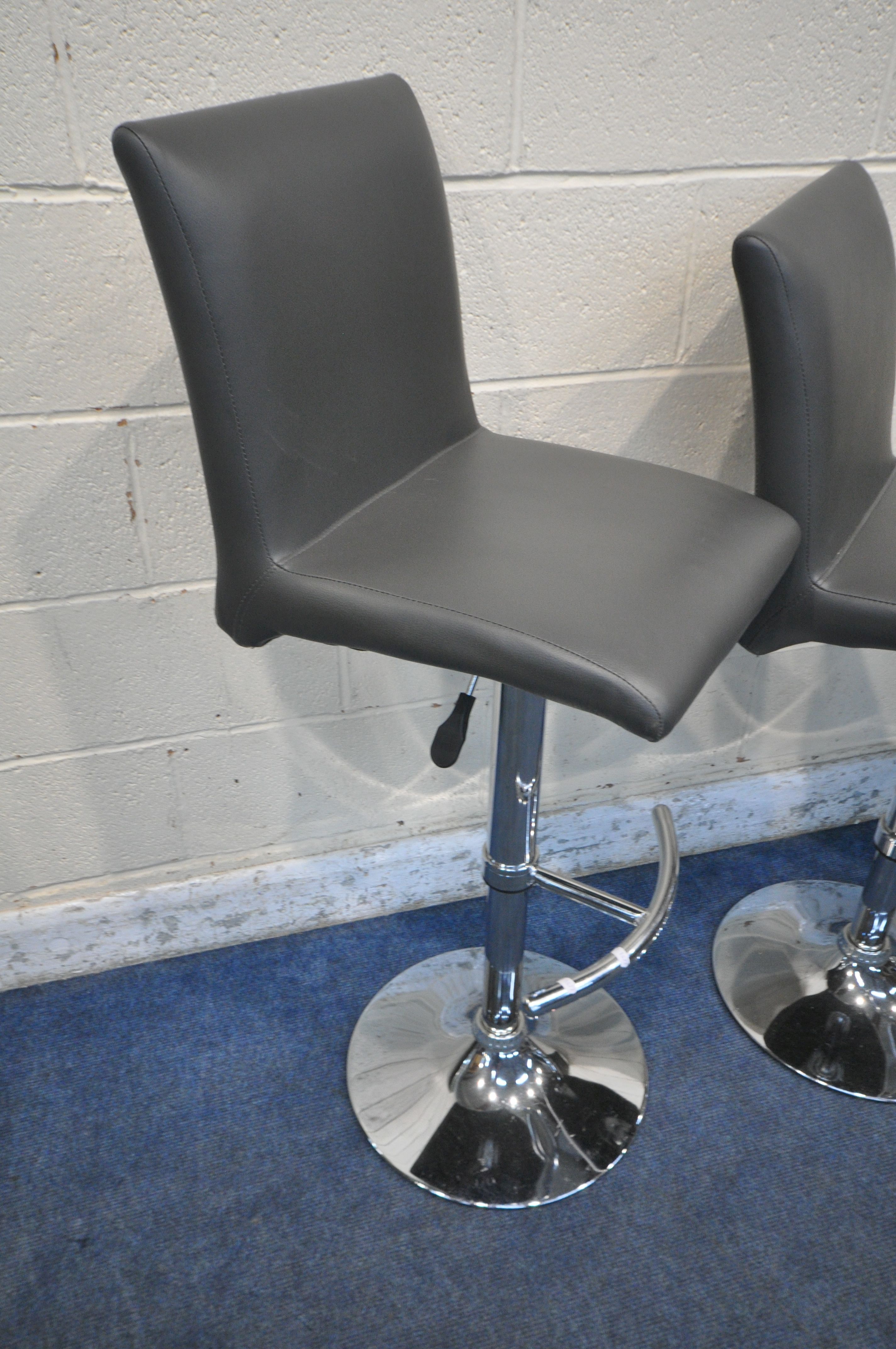 A SET OF THREE HEIGHT ADJUSTABLE BAR STOOLS, with charcoal grey leather upholstery, maximum height - Image 2 of 3