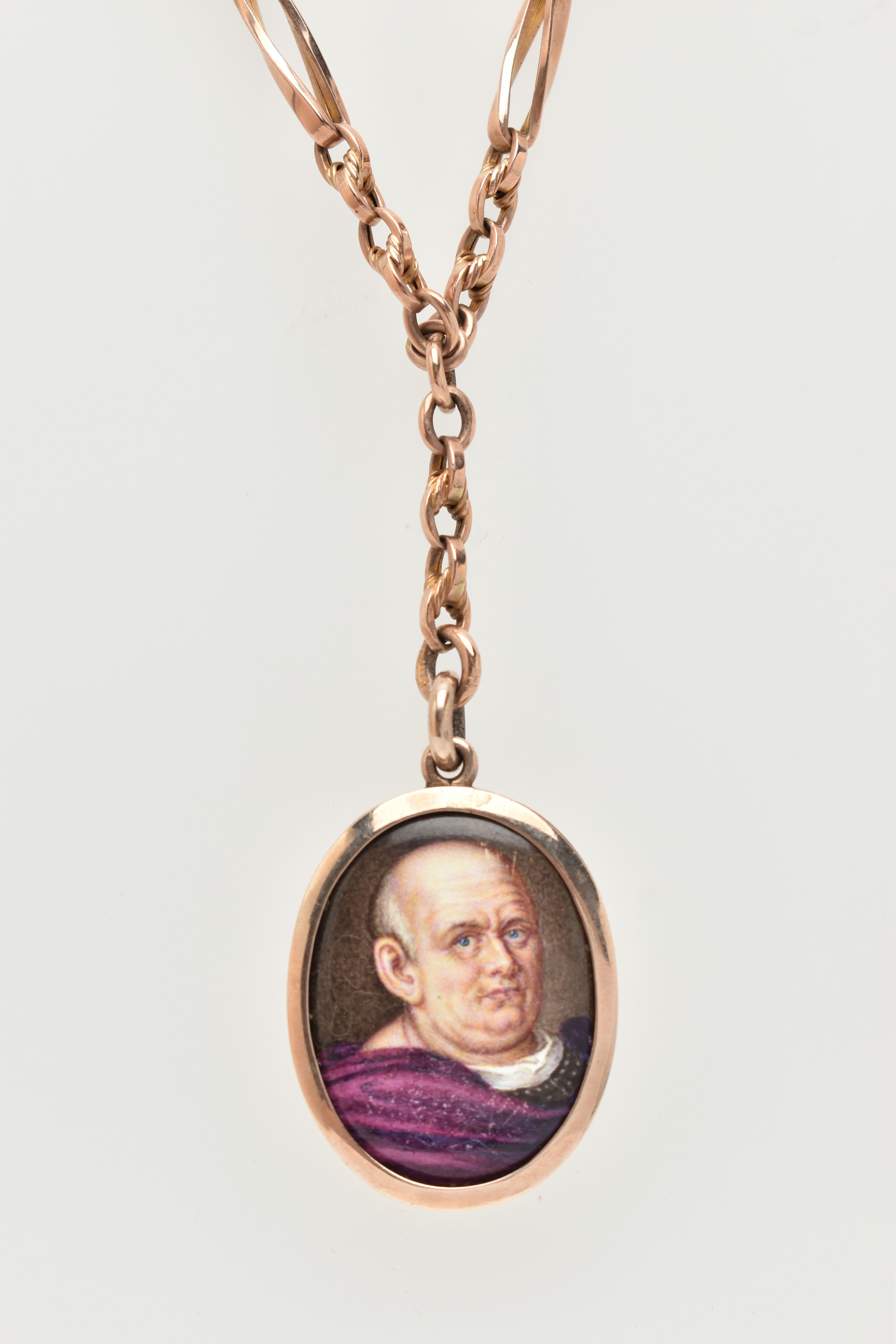 AN EARLY 20TH CENTURY MINIATURE PORTRAIT PENDANT AND CHAIN, the oval enamel pendant depicting a