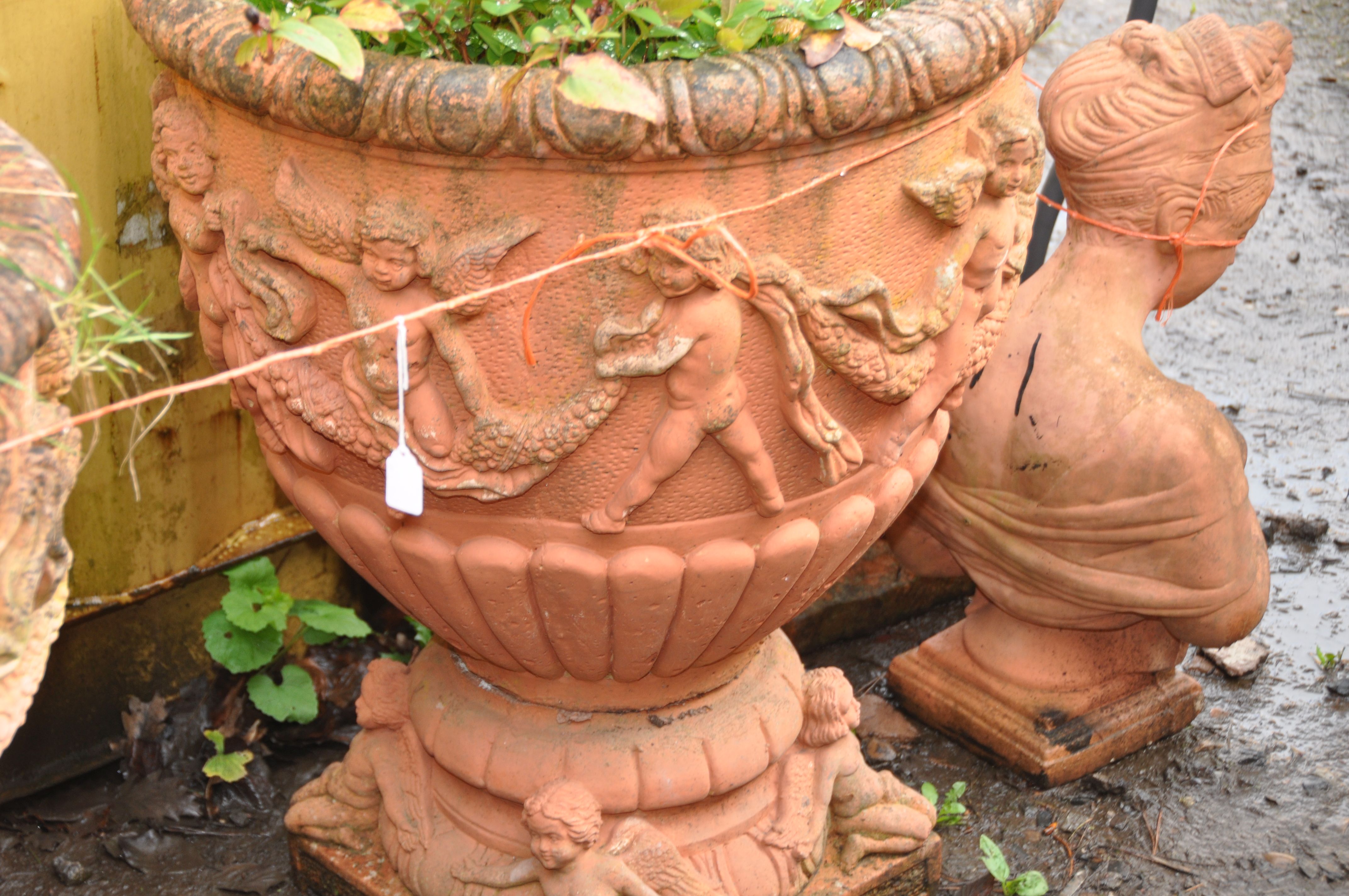 A PAIR OF LARGE MODERN COMPOSITE GARDEN URNS, terracotta painted, with Cherubs holding garlands of - Image 3 of 5