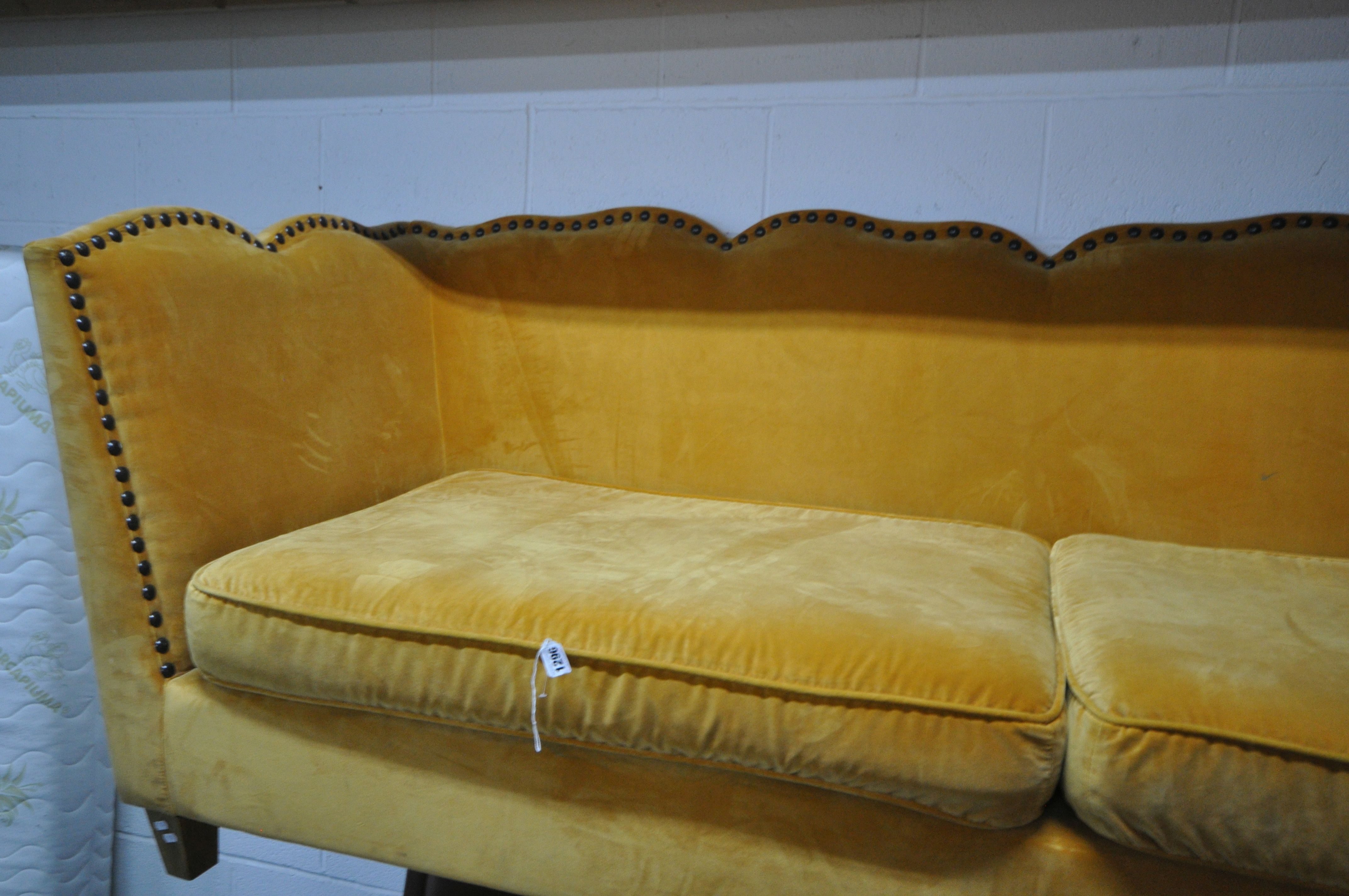 A GOLD VELOUR UPHOLSTERED SOFA, with a studded back, sides, and a shaped top, on square light oak - Image 5 of 8