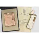 TWO LIGHTERS, to include a boxed gold plated 'S.T.Dupont' engine turned pattern lighter, signed to