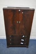 A KEAN AND SCOTT MAHOGANY TALL BOY, fitted with double doors, that are enclosing three shelves,