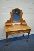 A 20TH CENTURY PINE DRESSING TABLE, with a single mirror, four drawers, raised on turned legs, width
