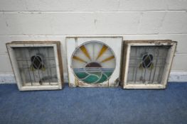 FOUR MATCHING LEAD GLAZED STAINED GLASS WINDOWS, frame size 50cm x 55cm, along with a circular