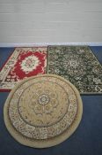 A GREEN GROUND RUG, with central medallion, repeating patterns and multi-strap border, 230cm x