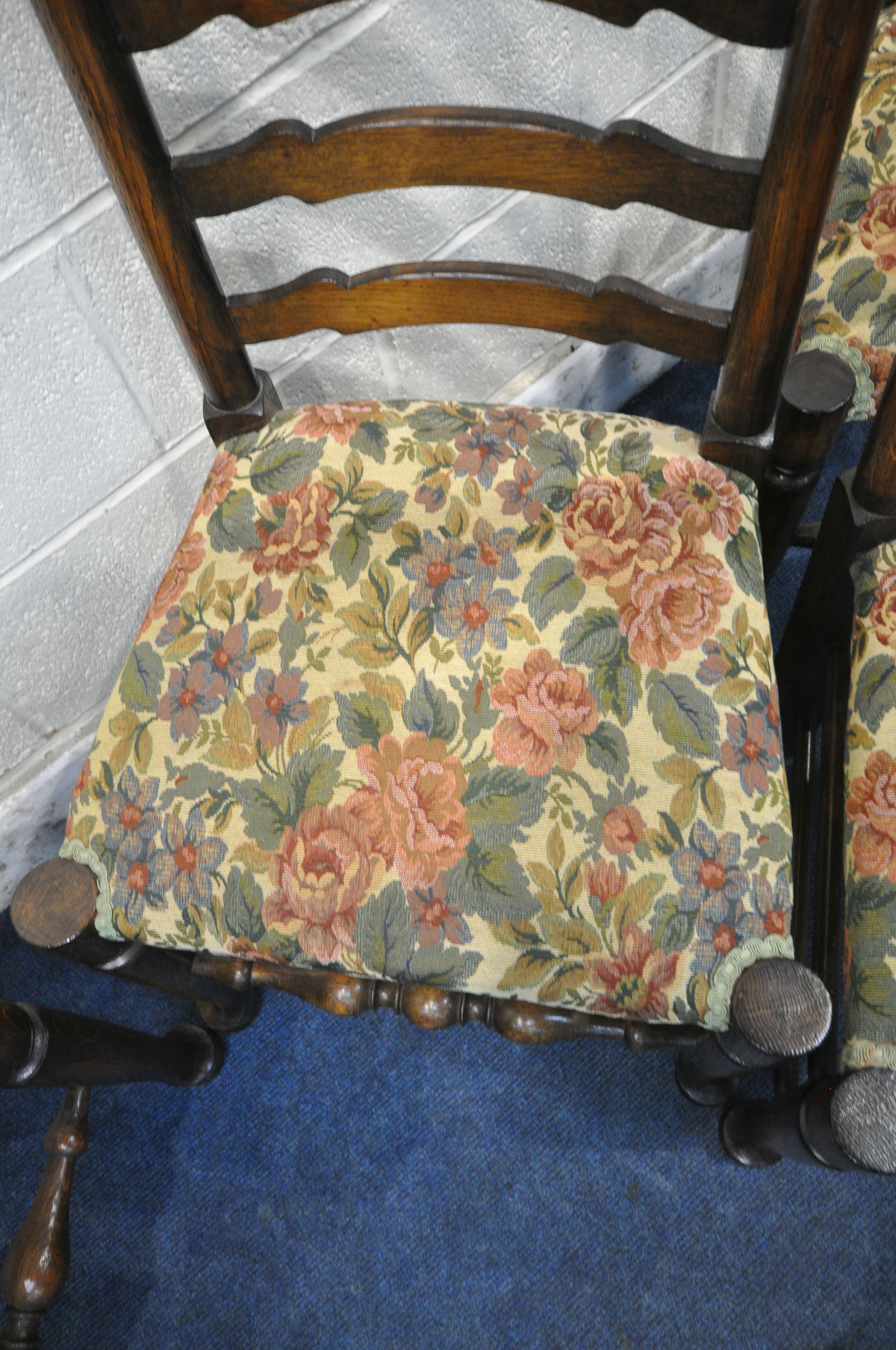 A SET OF SIX OAK LADDER BACK CHAIRS, with beige and floral upholstery, on turned legs and stretchers - Image 4 of 4