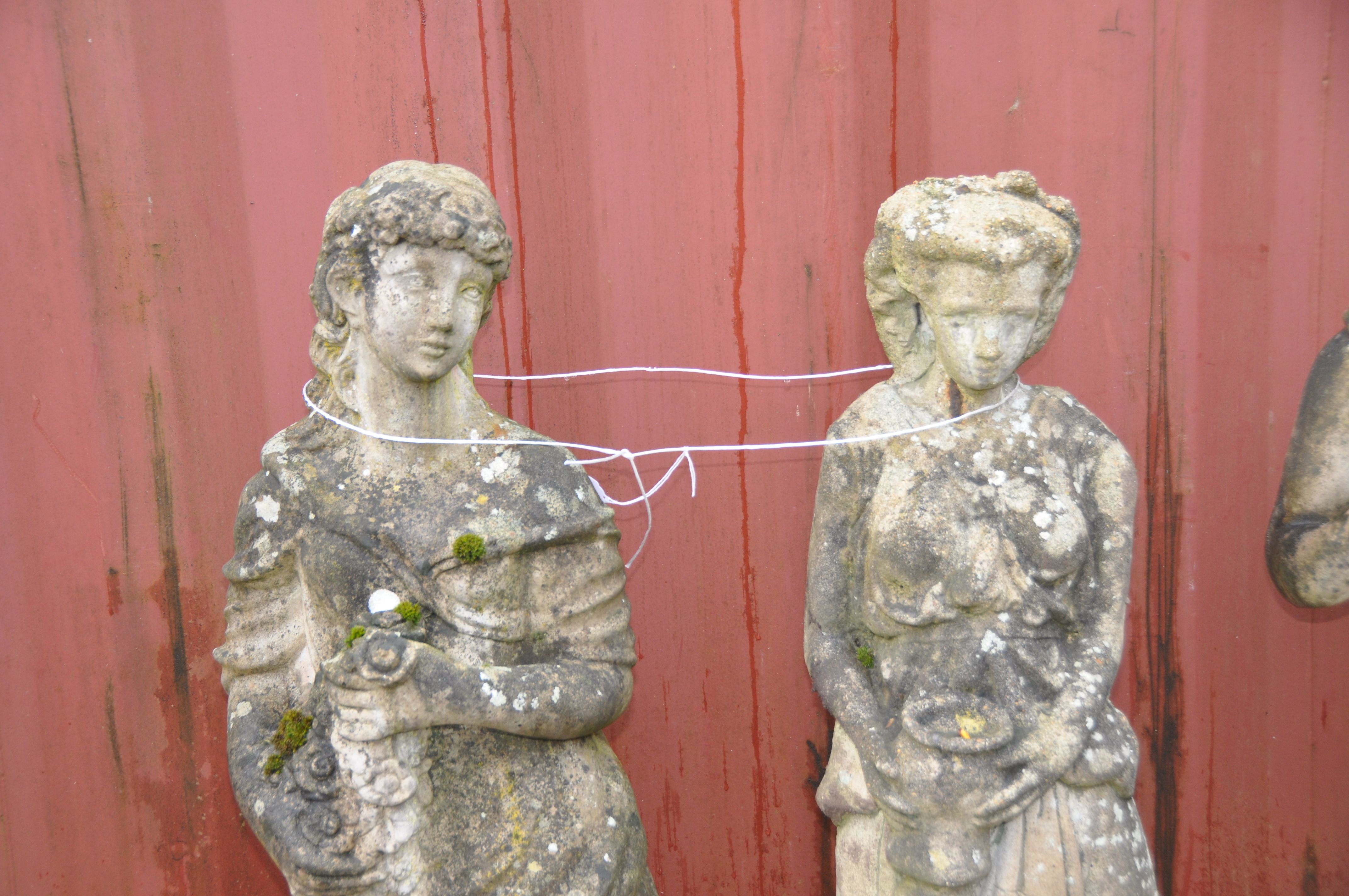TWO WEATHERED COMPOSITE GARDEN FIGURES OF GRECIAN LADIES both standing one carrying flowers 118cm - Image 2 of 3