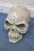 A MODERN COMPOSITE FIGURE IN THE FORM OF A SKULL, approximate height 29cm