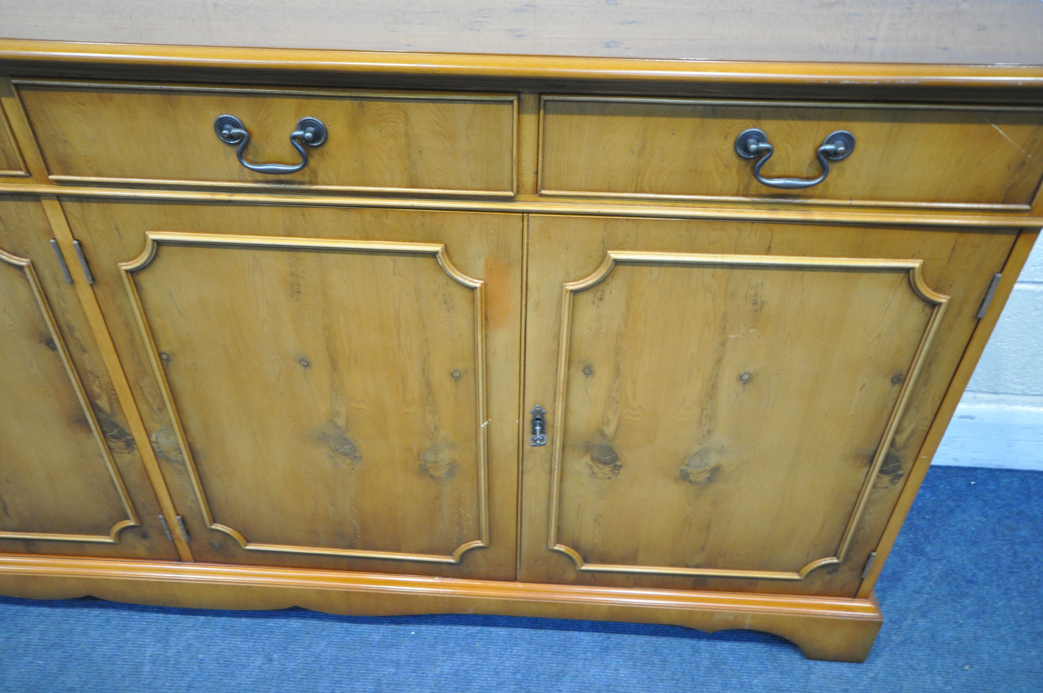 A 20TH CENTURY YEW WOOD TEN PIECE SUITE, comprising an oval twin pedestal dining table, with one - Image 7 of 7