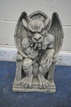 A MODERN COMPOSITE GROTESQUE, seated on a throne width 30cm x depth 20cm x height 48cm (condition-