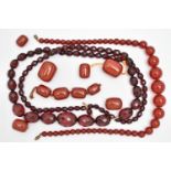 AN ASSORTMENT OF BAKELITE CHERRY AMBER BEADS, to include a necklace comprised of graduating