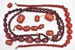 AN ASSORTMENT OF BAKELITE CHERRY AMBER BEADS, to include a necklace comprised of graduating