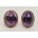 A PAIR OF AMETHYST CABOCHON STUD EARRINGS, the oval cabochon in a collet setting with rope twist