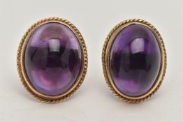 A PAIR OF AMETHYST CABOCHON STUD EARRINGS, the oval cabochon in a collet setting with rope twist