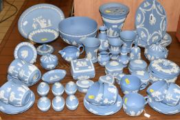 A LARGE QUANTITY OF BLUE WEDGWOOD JASPERWARE, comprising two cabinet plates, one oval plaque,