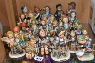 A GROUP OF TWENTY SIX MID-CENTURY GOEBEL FIGURES, comprising 195 Barnyard Hero, 110 Lets Sing, 69