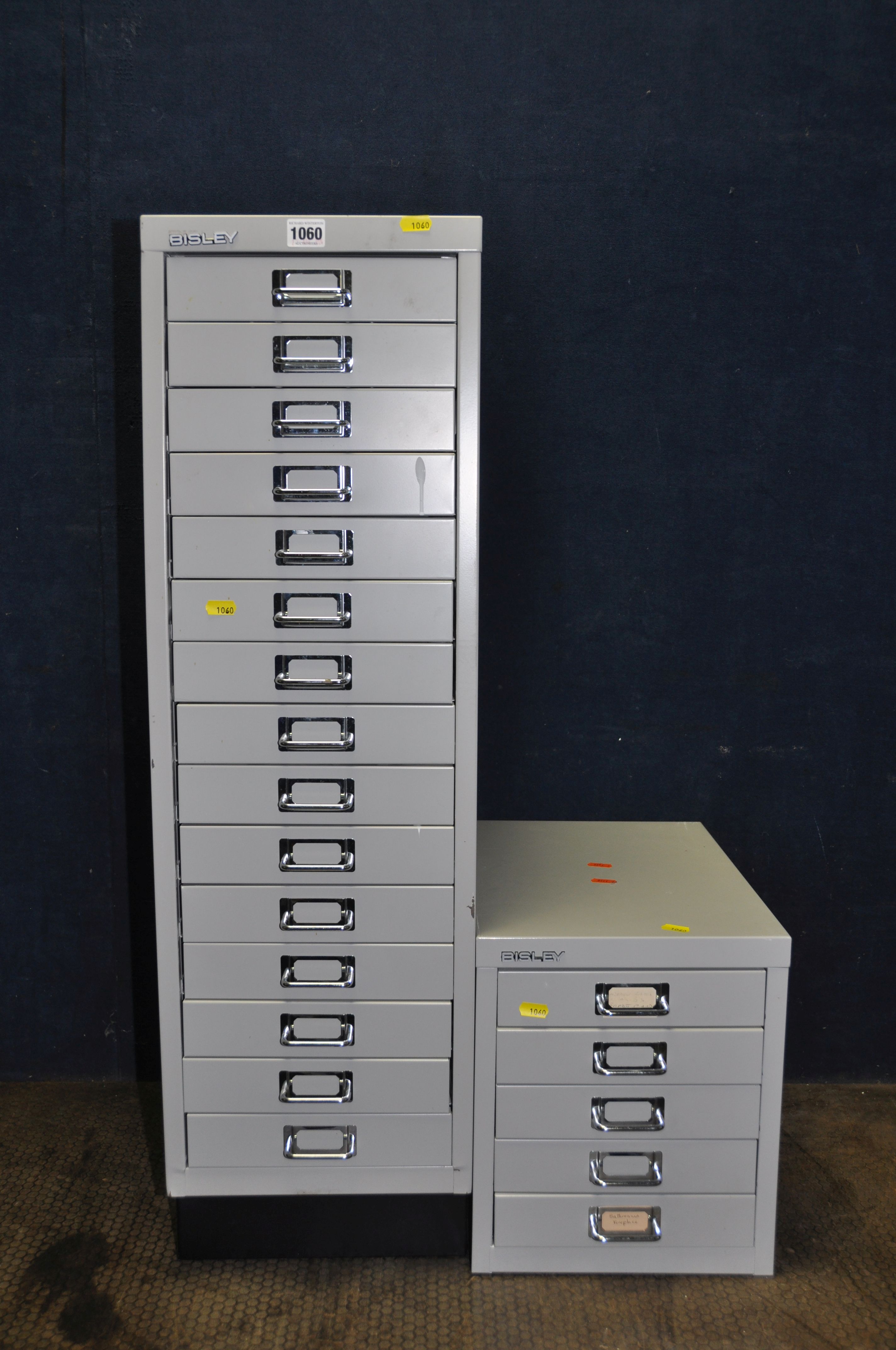 TWO BISLEY OFFICE FILE DRAWERS metal in construction the tall one with fifteen drawers 94cm high,